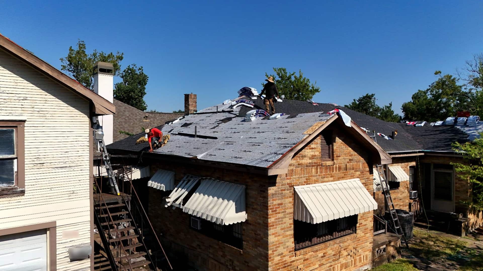 Tex Roof crew installing new shingles on a home in Plum Creek, Kyle, Texas
