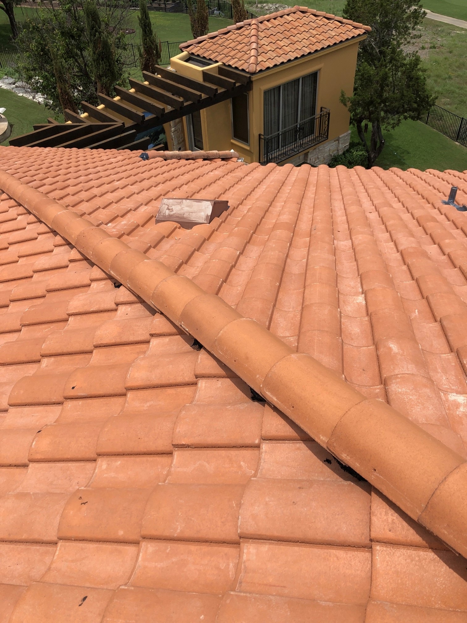 Standing seam metal roof on a hillside home overlooking Lake Travis in Lakeway