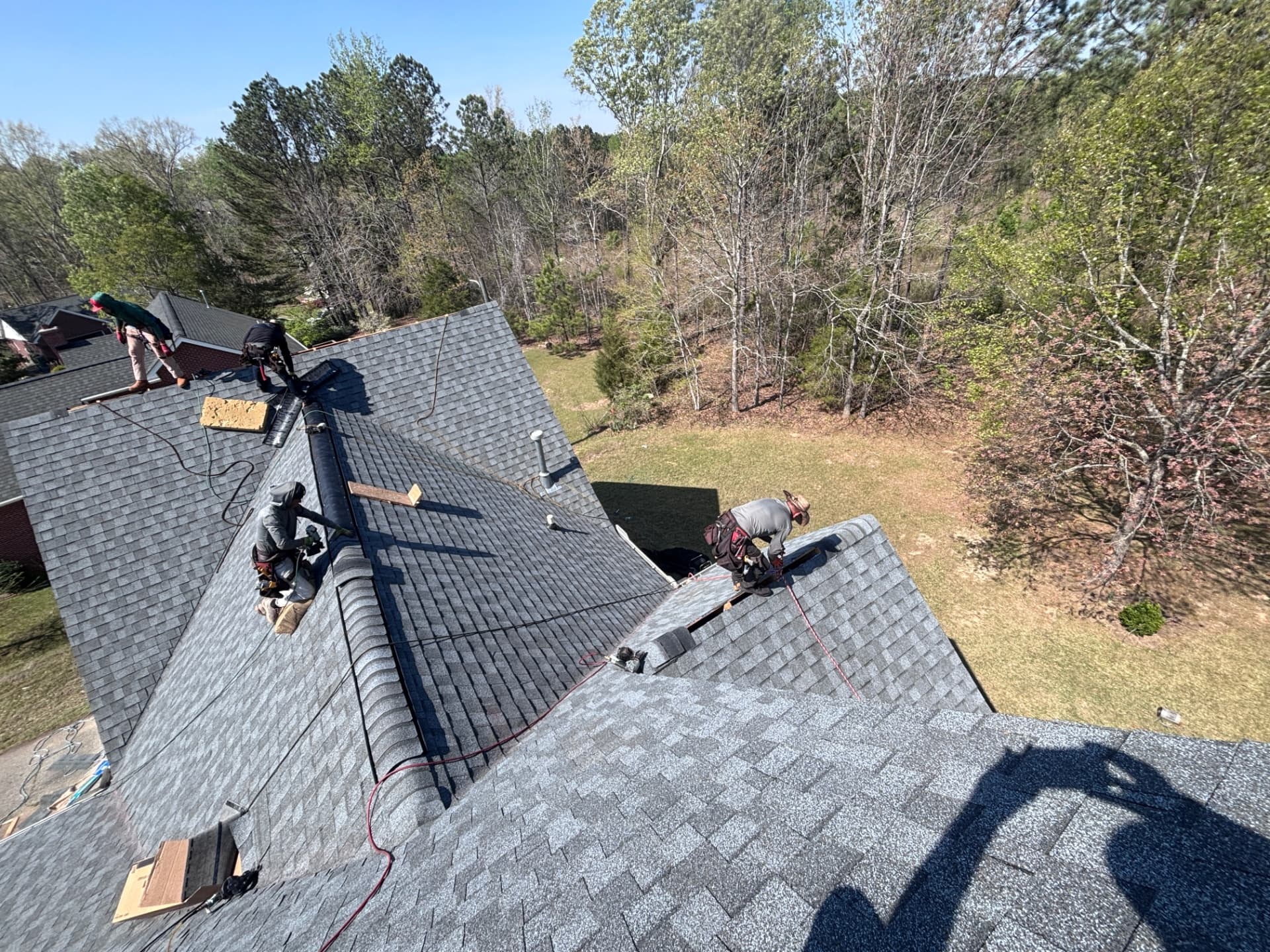 Tex Roof crew members working on a roof in Austin