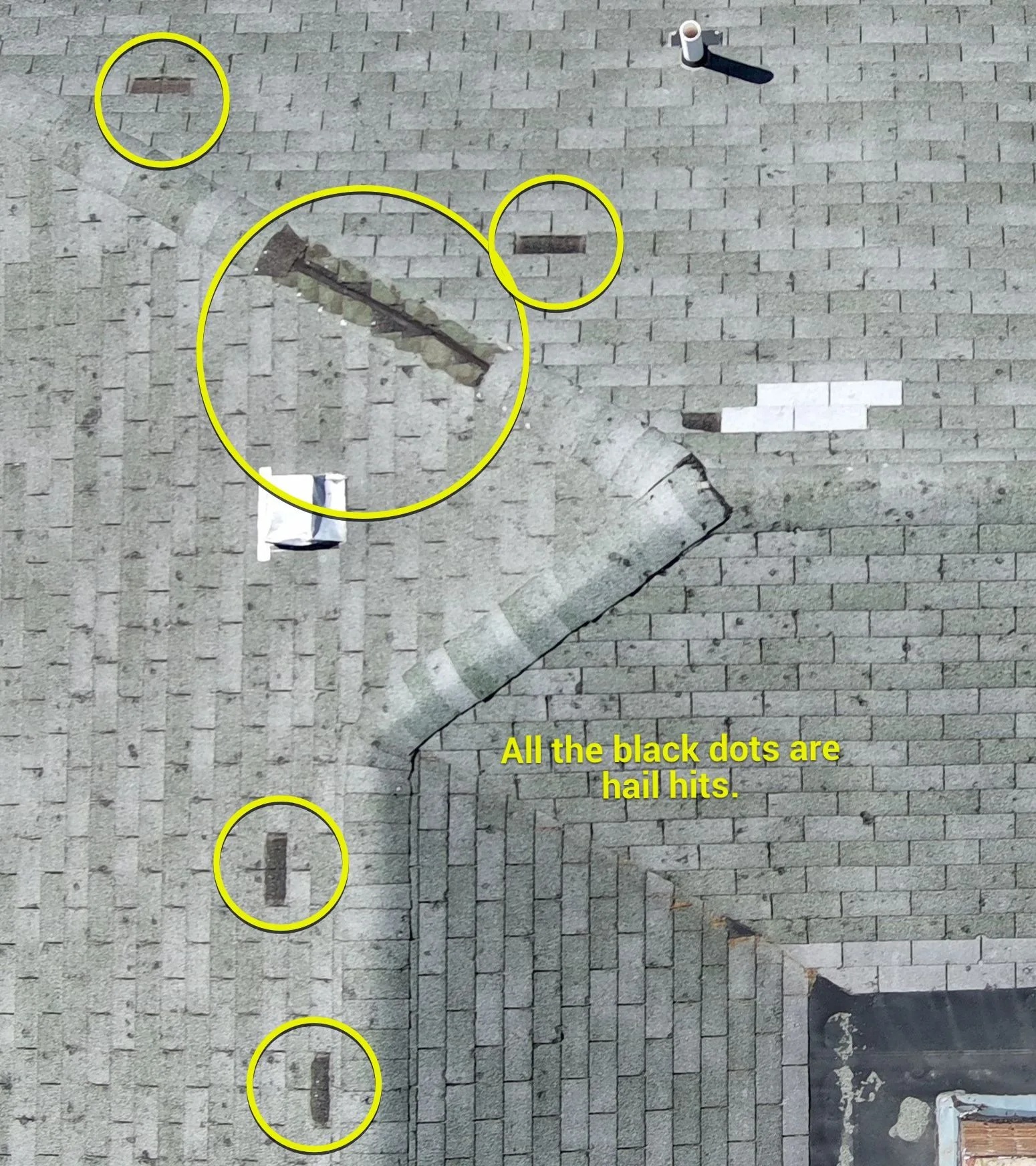 Inspector documenting hail damage on a Georgetown roof with chalk-marked test square